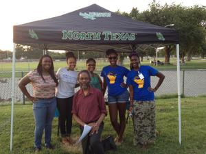 People under tent at Juneteenth celebration