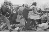 Alabama state troopers attacking civil rights marchers on Bloody Sunday in Selma, Alabama.