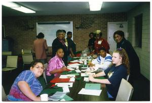 Women Decorating Stockings During Peacock Village Christmas Activity