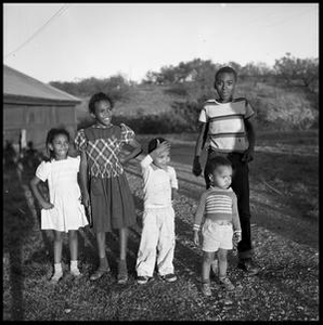 Children Standing Outside Bunkhouse