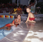 Thumbnail for Gwen Gordy Fuqua and a young boy at Berry Gordy's house party, Los Angeles