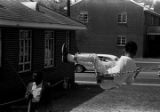 Little girl on a swing in George Washington Carver Park in Selma, Alabama, during a commemoration of the Selma to Montgomery March.