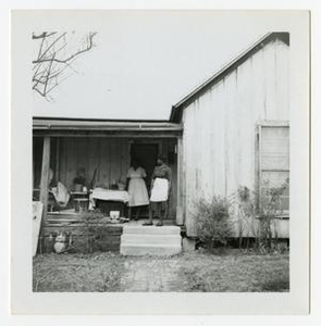 Women Outside a House