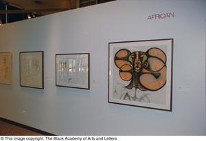 Photograph of an African gallery wall, featuring four art pieces