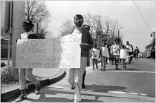 Sanitation workers strike supporters marching on Martin Luther King Jr. Drive in downtown Atlanta, Georgia, March 28, 1970. Photograph is part of a series labeled "Strike march."