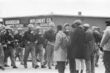 Alabama state troopers confronting civil rights marchers who have crossed the Edmund Pettus Bridge on Bloody Sunday in Selma, Alabama.