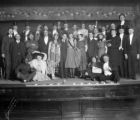 Group photo of men in costumes