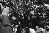 Robert F. Kennedy walking through the crowd at Martin Luther King, Jr.'s funeral.