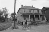 Young man riding bicycle.