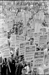 [Demonstrators marching in the street holding signs during the March on Washington, 1963]