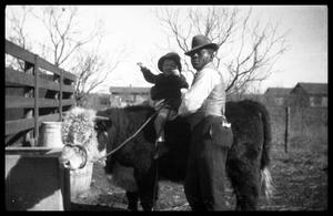 Man and Toddler with a Calf