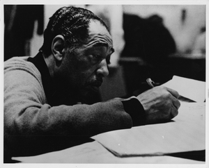 Duke Ellington composing at the piano during a State Department tour in Pakistan: black-and-white photoprint.