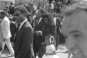 Coretta Scott King on the arm of Alfred D. King during the funeral procession for Martin Luther King, Jr.