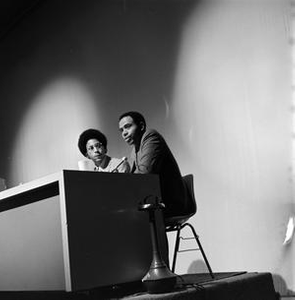 Two men sitting at an RTDNA conference