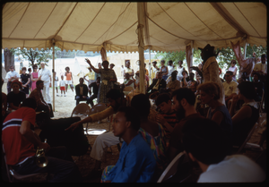 Group gathering to hear speakers under a large tent at the Resurrection City encampment