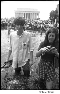 Stephen Davis wading in a Mall reflecting pool during the Poor People's Campaign Solidarity Day