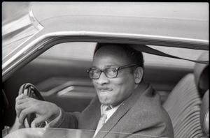 Thumbnail for African American driver looking out his car window