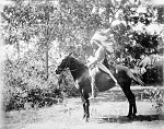 Arthur Mitchell on horseback