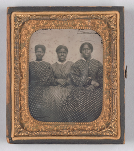 Ambrotype of three women in dotted calico dresses