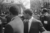 Pallbearers rolling Martin Luther King, Jr.'s casket down the street.