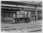 [Union Station, Washington, D.C.: Electric baggage truck operated by baggage porter]