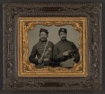 Thumbnail for [Two unidentified soldiers in Union uniforms, one wearing musician's uniform and holding Model 1840 musician's sword, the other holding Colt Model 1851 Navy revolver]