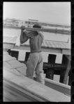 Thumbnail for Negro stevedore removing lumber from packet boat "El Rito," Pilottown, Louisiana