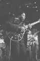 B. B. King: New Haven, Conn. Performing at Yale University for students. Bill Ferris at podium. B. B. King performing on stage at ""Lucifers"" in Boston, Mass (BKP 11-76-5)