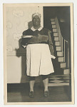 Woman in blackface and maid's costume