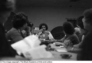 Unidentified man leading conference at Sheraton Inn