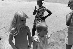 Children standing in the grass