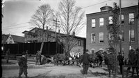 Spectators watching team of horses pull railroad car, Hartford, October 28, 1911