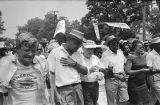 Whitney M. Young Jr., Walter Reuther, Juanita Abernathy, Ralph Abernathy, Coretta Scott King, Martin Luther King, Jr., Floyd McKissick, and other marchers in Jackson, Mississippi, near the end of the March Against Fear begun by James Meredith.