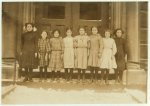 Group of Cannery Workers, School #1, Buffalo, N.Y. (from left to right): 1) Rose Paralto, 12 years old last summer. Helped mother on strawberries, Canning Factory, Simcoe, Canada. Entered school, January 3d, 1910. Last year, school work excellent, this year not good. 2) Josephine Pellina, 10 years old last summer. Strings beans in sheds of Forestville[sic?], Cannery. Came to school in September. 3) Christian Cengo, 10 years old last summer. Worked stringing beans in sheds Forrestville Cannery sometimes until 8 or 9 P.M. 4) Anna Gengo, 10 years old last summer. Sheds of Forrestville Cannnery. 5) Metea Spana, 13 years old last summer. Worked on peas and beans in the sheds of Eden Center Canning Factory. 6) Josephine Leone, 12 years old last summer. Helped in the sheds at Barker Cannery. 7) Frances Imperllario, 11 years old last summer. Worked on berries Cherry Creek Factory. 8) Mary Lefesso, 12 years old last summer. Worked at Barker Canning Factory. Entered school October 22d.  Location: Buffalo, New York (State)