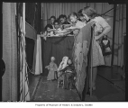 Children operating puppets in Nativity scene, Seattle, 1948