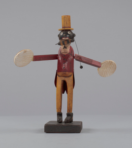 Whirligig in the form of a caricatured man swatting a bee