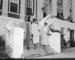 Autherine Lucy and others leaving the Administration Building at the University of Alabama after enrolling on her first day.