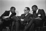 Congressman Carl Elliott seated with two other men during a meeting of educators at Alabama State College in Montgomery, Alabama.