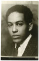 Photograph of young Langston Hughes. Signature of Langston Hughes, backside of photograph.