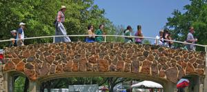 Visitors walking across bridge, 2008