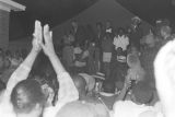 Young man preparing to address an audience in front of a tent at an evening gathering during the "March Against Fear" through Mississippi, begun by James Meredith.