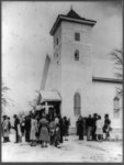 A Negro congregation in front of a church after the service