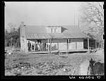 Negro family (rehabilitation clients) on porch of new home they are building near Raleigh, North Carolina