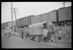 [Untitled photo, possibly related to: Day laborers being hired for cotton picking on Mississippi and Arkansas plantations. Between four and six-thirty every morning during the season, near the Hallan Bridge in Memphis, Tennessee, crowds of Negroes in the streets gather and are loaded into trucks by drivers who bid, and offer them anywhere from fifty cents to one dollar per day]