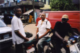 Eugene Redmond sitting on a motor scooter