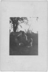 [Two African American men, squatting, Eatonville, Florida]