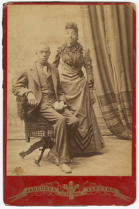 Photograph of a man and woman in formal clothes