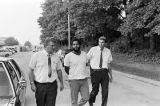 Sergeant Clifford Vasser and Lieutenant Doug Acker escorting Anthony Ray Hinton to the city jail in Bessemer, Alabama.