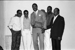 Jerry Robinson poses with members of "Pieces of a Dream," Los Angeles, 1986