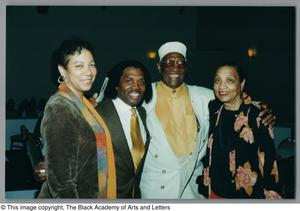 Photograph of Curtis King and Albert Lipscomb posing with two women